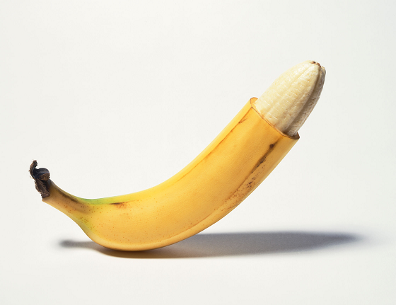 quarter way peeled banana representing a penis